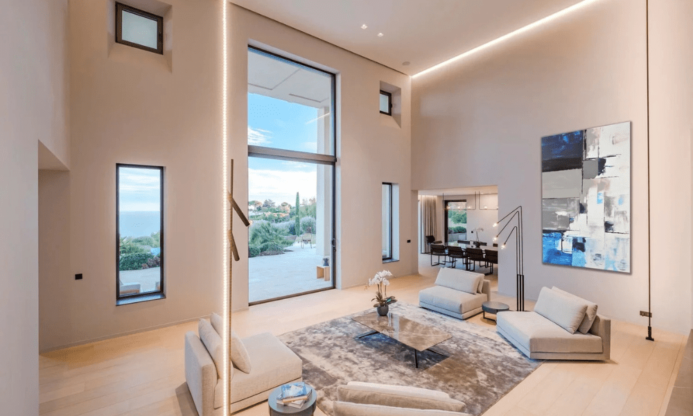 Modern living room interior with natural light and garden views
